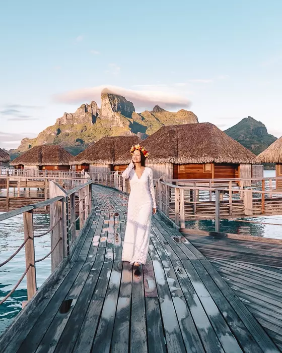 Four Seasons Bora Bora walking at sunrise with Mount Otemanu behind by Dancing the earth
