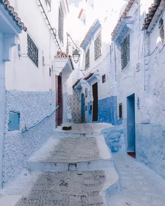 Morocco travel guide Chefchaouen light-blue winding stairs by Dancing the Earth