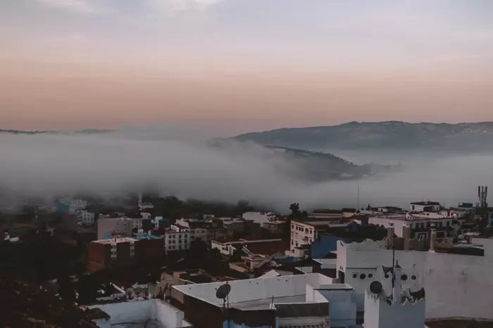 Morocco travel guide Chefchaouen inverted clouds at sunrise by Dancing the Earth