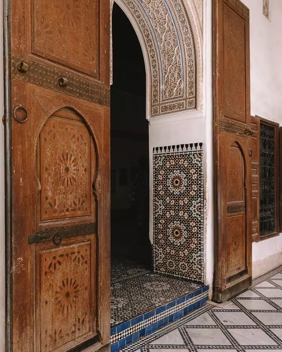 Morocco travel guide Bahia Palace carved wood door with tiles by Dancing the Earth