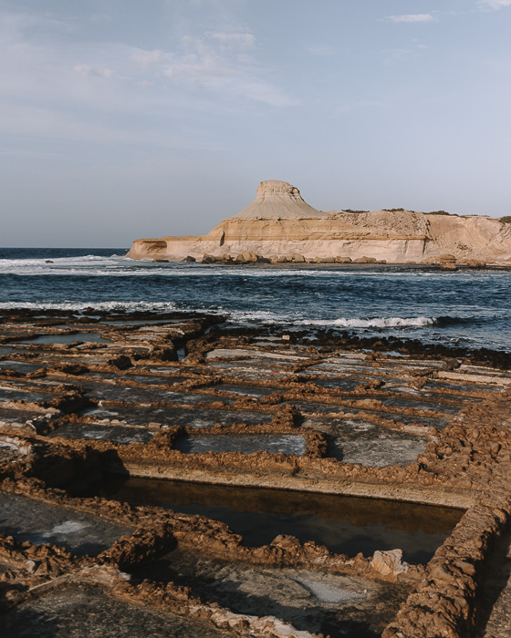 Gozo island golden hour on Ghajn Barrani salt pans by Dancing the Earth