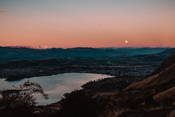 Full moon over Wanaka and the lake at sunset, Dancing the Earth