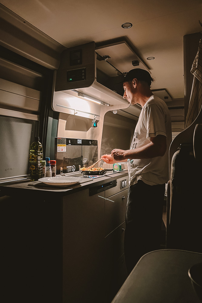 Campervan Travel, cooking in the kitchen, by Dancing the Earth