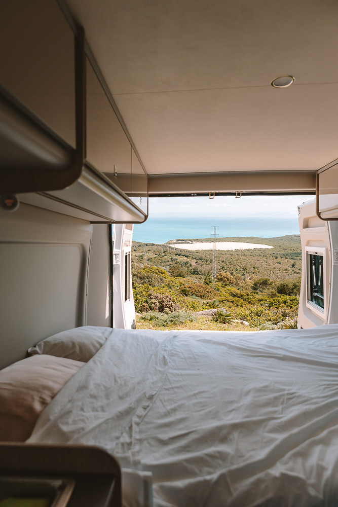 Campervan Travel, bed with a view, by Dancing the Earth