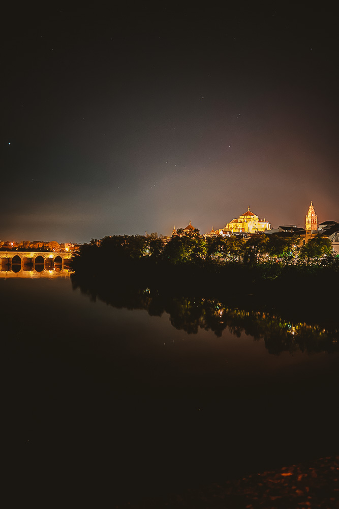 Cordoba, Puente Romano and Mezquita by night, by Dancing the Earth